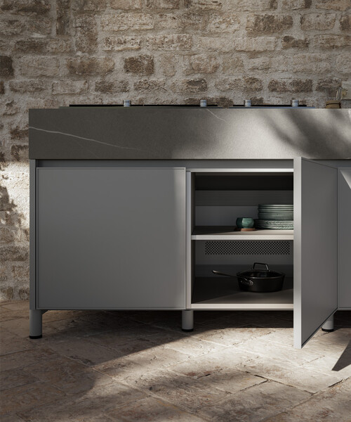 Aura outdoor kitchen on a deck at dusk