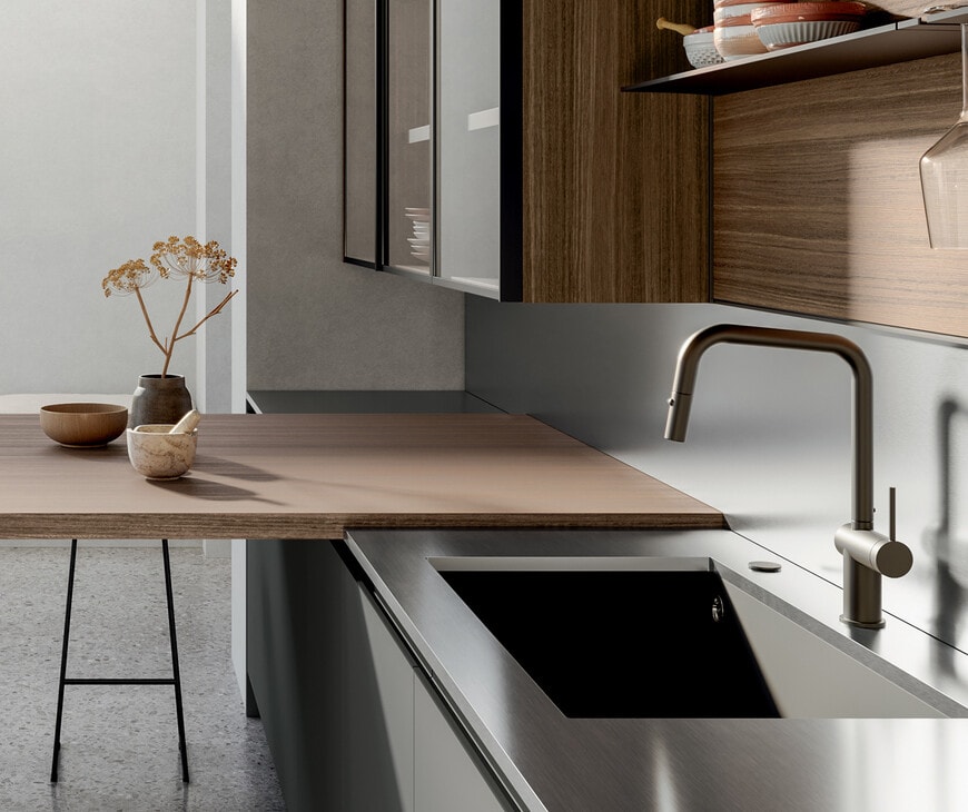 Cucina kitchen with stainless steel countertop, sink and faucet